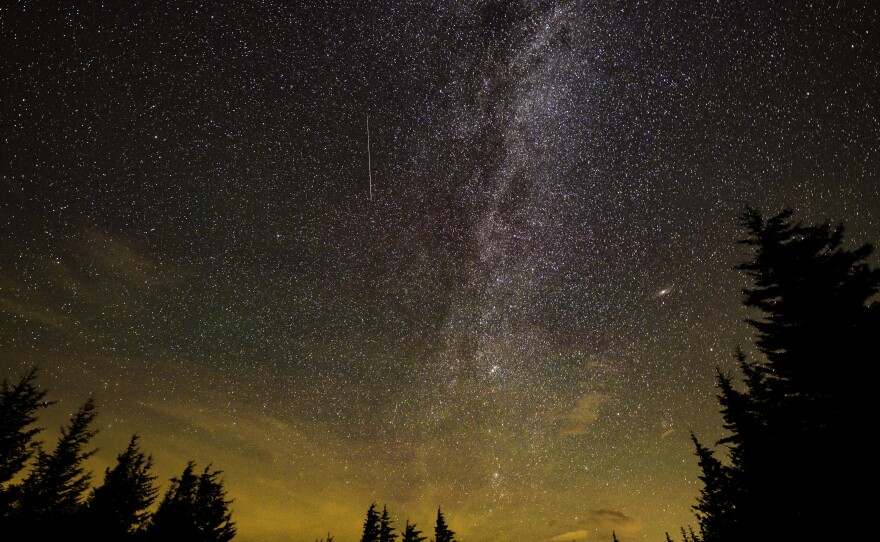 In this 30 second exposure, a meteor streaks across the sky during the annual Perseid meteor shower on Aug. 11, 2021 in Spruce Knob, W.Va.