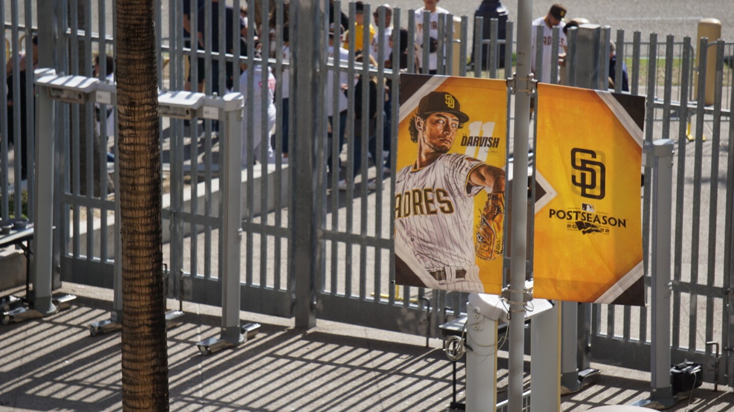 A banner at Petco Park shows Padres pitcher Yu Darvish during San Diego Padre Fanfest.