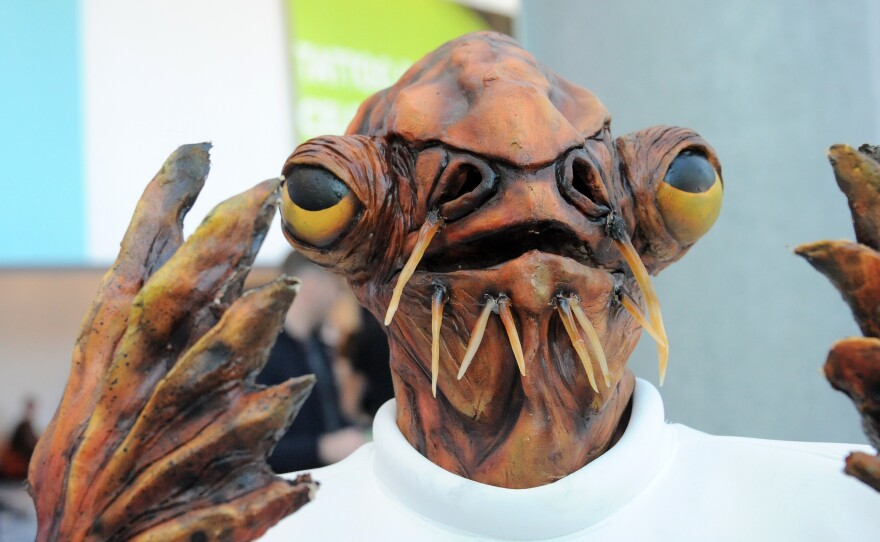 A cosplayer dressed as Admiral Ackbar poses at Disney's 2015 Star Wars Celebration in Anaheim, Calif.