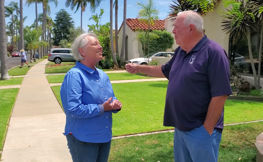 Kelly Martinez, a candidate for San Diego Sheriff, speaks to a supporter in Kensington, May 14, 2022.