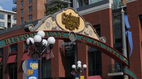 A sign hangs over the entrance to the Gaslamp Quarter on Fifth Avenue in downtown San Diego. 