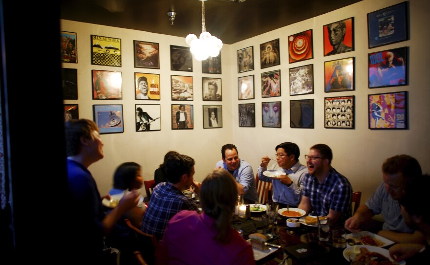 Computer software designers and engineers gather for a "hack night" at the Capdeville bar and restaurant in New Orleans. The city has a fledgling tech industry.