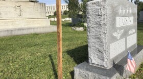 A wooden spike marks the spot, Saturday, Aug. 25, 2018 where Sen. John McCain, R-Ariz., will be buried on the grounds of the U. S. Navel Academy in Annapolis, Md. 