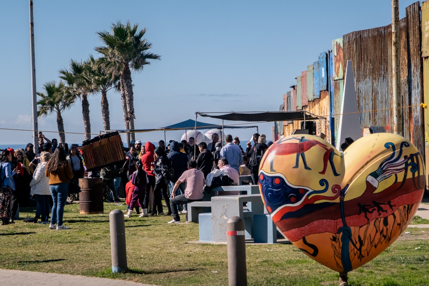 Migrant activists celebrate Christmas in binational Friendship Park as possible closure looms.
