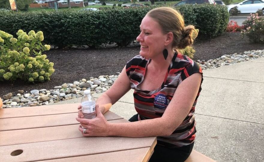 Lysa Kosins, one of the candidates challenging the incumbents for the Centerville school board, meets with voters at a local ice cream shop.
