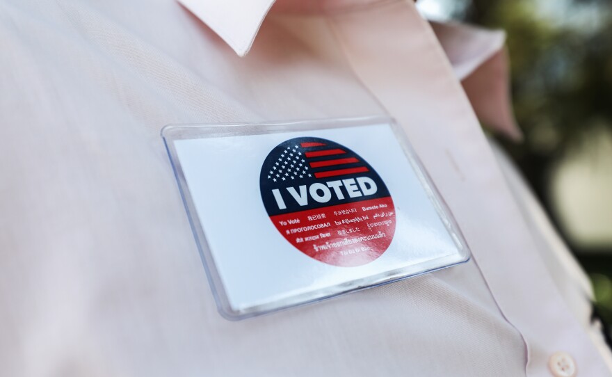 A voter wears an "I Voted" badge after placing a ballot in a drop box in Los Angeles last week. Officials say members of the Republican Party have illegally placed unauthorized drop boxes in some locations.