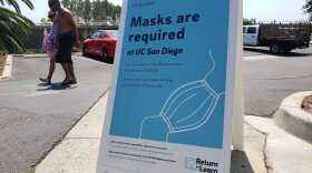 A sign advising of coronavirus precautions on the campus of Scripps Institution of Oceanography. Aug. 22, 2020.