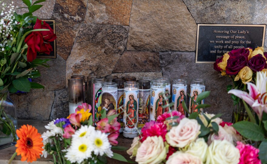 Candles of the Mexican Virgin of Guadalupe sit outside the church where Kevin's Mass took place on June 17, 2023.