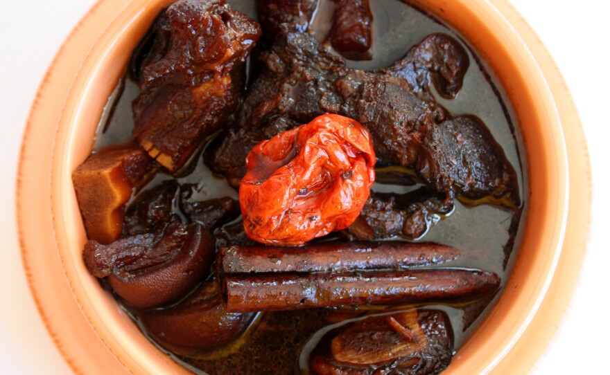 Pepperpot, a traditional Guyanese Christmas dish, is basically a stew of aromatics and tough meat parts like shanks, trotters and tails that benefit from a long cooking.