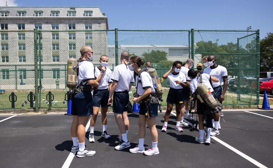Midshipmen participate in fire safety training on campus in Annapolis.
