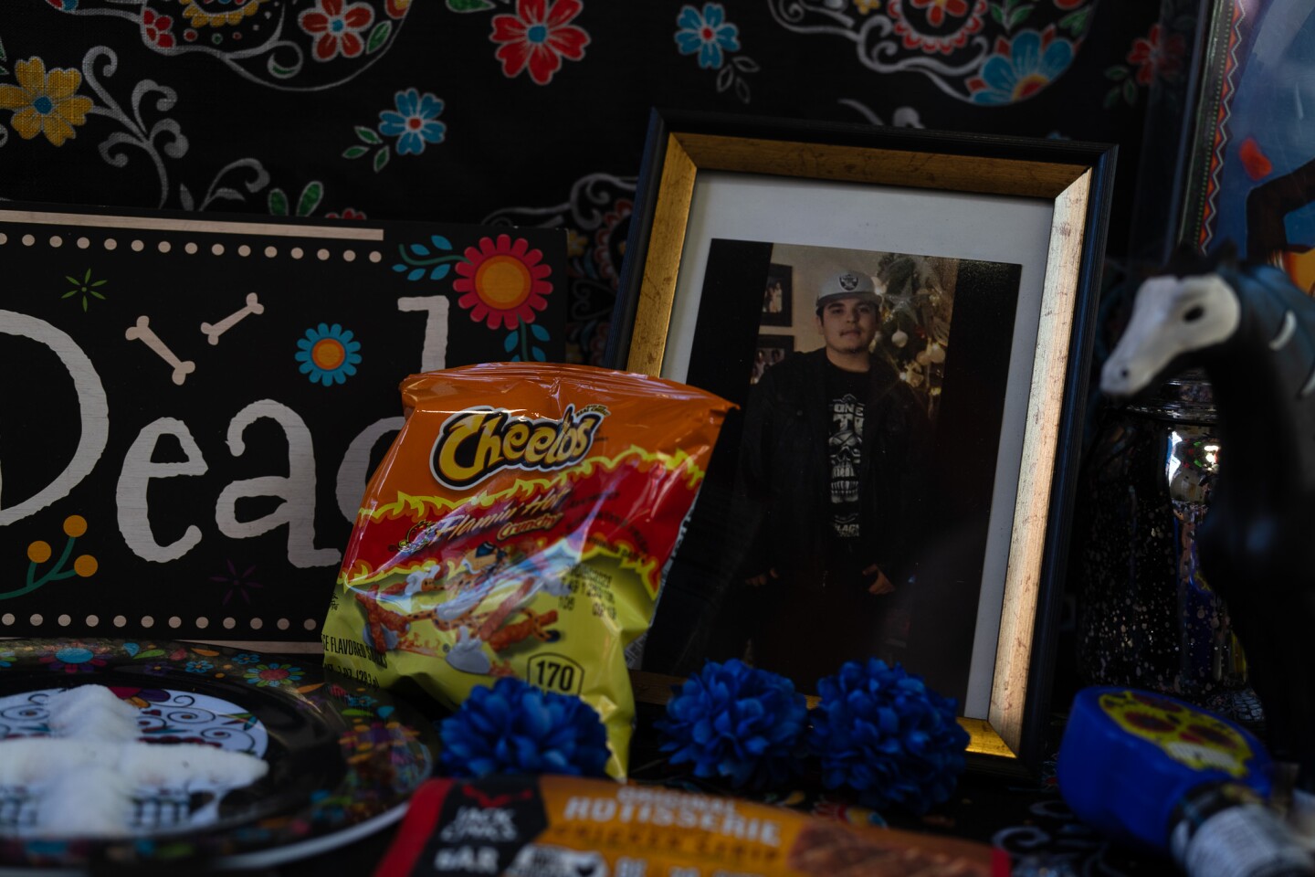 A bag of Flamin' Hot Cheetos is one of the ofrendas, or offerings, placed on an altar remember lost loved ones in the Sherman Heights Community Center in San Diego on Oct. 17, 2023. Ofrendas are placed on altars during Día de