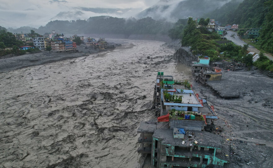 A drone view of the aftermath of flash flooding along the Trishuli river amidst fresh water surge warning in the Trishuli Bazaar area of Nuwakot district, Nepal, Sunday, Aug. 30, 2026. (AP Photo/Rajesh Kumar Singh)