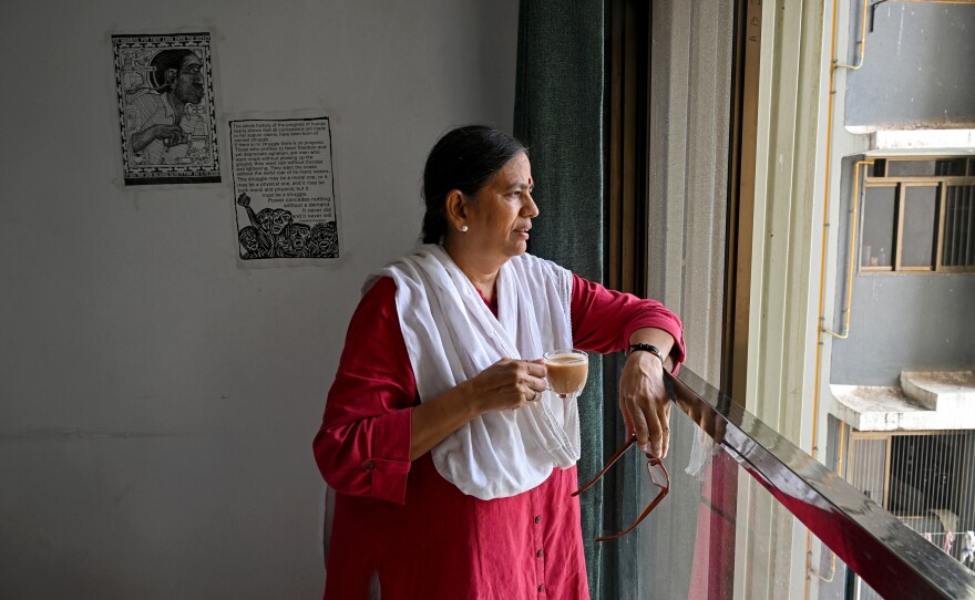Activist and lawyer Sudha Bharadwaj drinks tea as she looks out the window of her residence in Mumbai on Oct. 19, 2023. In the summer of 2021, while incarcerated as one of those accused in the Bhima Koregaon case, she received a letter from Swamy in which he had written some of this last words.