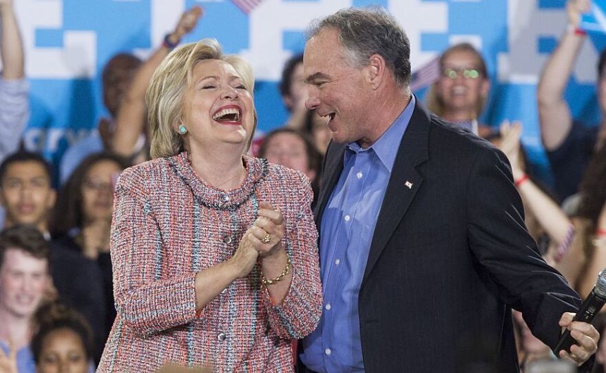 Democratic Presidential candidate Hillary Clinton and Sen. Tim Kaine laugh at a campaign rally in Annandale, Virginia, on July 14.