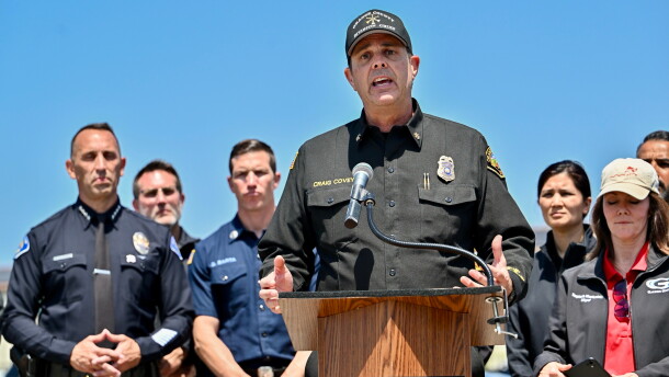Orange County Fire Authority Division Chief Craig Covey speaks during a news conference at the Los Alamitos racetrack in Cypress, Calif., on Friday about a hazardous material situation in Garden Grove, Calif.