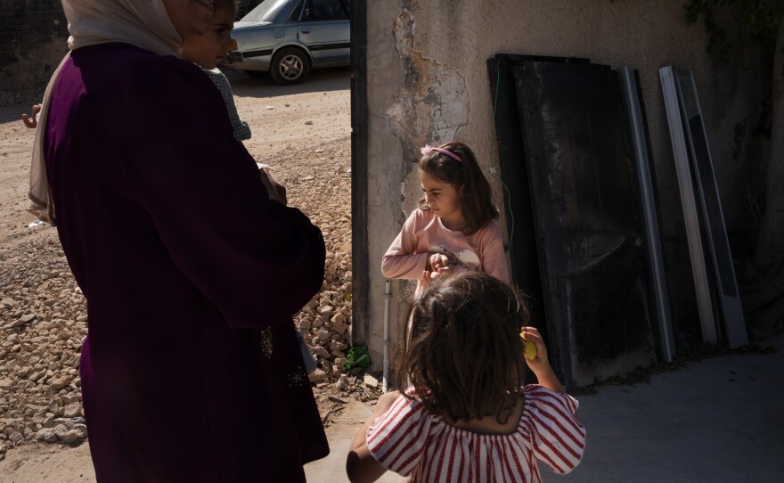 Sarah Zakarneh, 5, and her family live around the corner from the Al-Ansar Mosque. The family was sleeping when the airstrike hit and after waking up they fled to a family member's house outside of town.
