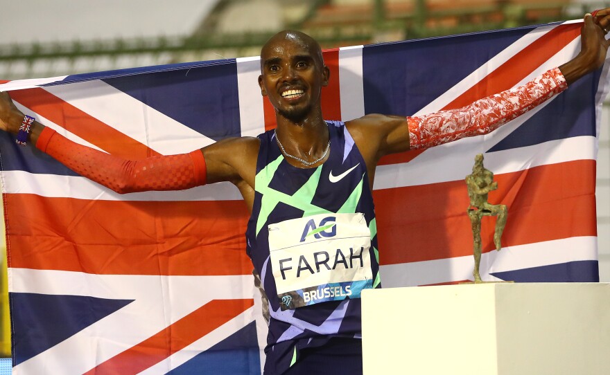 Mo Farah is one of the world's most successful track athletes, but he says he was first brought to the U.K. and forced to work as a child servant. He's seen here celebrating winning the One Hour Race at the Memorial Van Damme Brussels 2020 Diamond League meeting in Belgium.