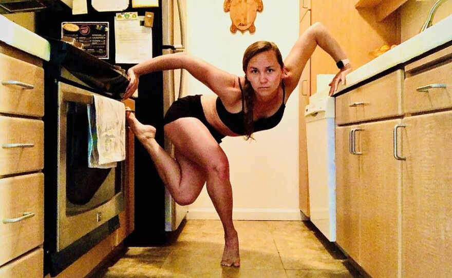 Kymmi Kellem dances in her kitchen for PGK Dance Project's "While We Were Home" program in an undated still.
