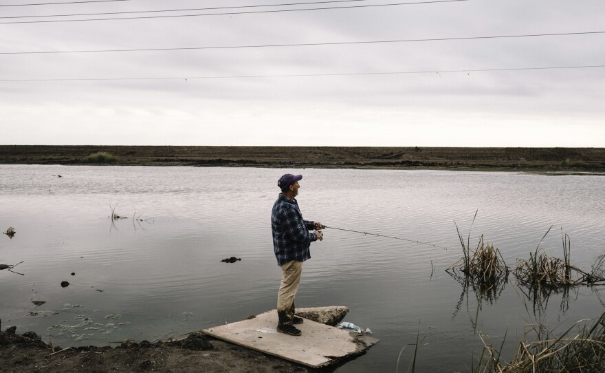 Buddy Melancon fishes on Falgout Canal Road in rural Terrebonne Parish, near the Gulf of Mexico.