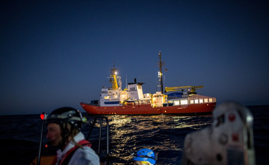 The Aquarius, a former North Atlantic fisheries protection ship now used by humanitarian groups SOS Mediterranee and Medecins Sans Frontieres (Doctors Without Borders), is seen in December 2017 during a rescue operation in the Mediterranean Sea. The rescue ship was stranded this weekend after Italy and Malta refused to allow it to dock.
