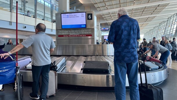 Passengers wait for their luggage at San Diego International Airport's Terminal 2, Nov. 6, 2025.