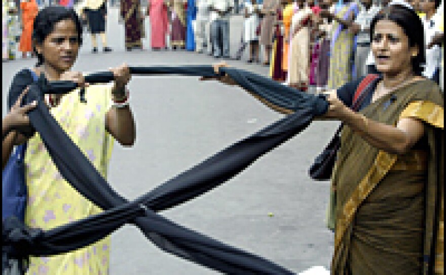 Indian activists hold a black ribbon as they take part in an HIV awareness rally in June.