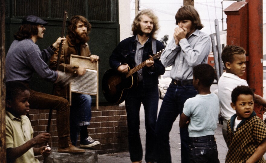 The members of Creedence Clearwater Revival during a street performance and photo shoot in Oakland, Calif. for the band's <em>Willy and the Poor Boys </em>album, also released in 1969.