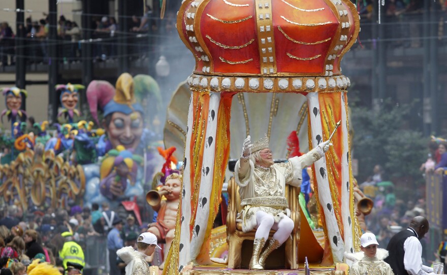 Rex, the King of the Carnival, arrives to fanfare at the intersection of St. Charles Avenue and Canal Street.