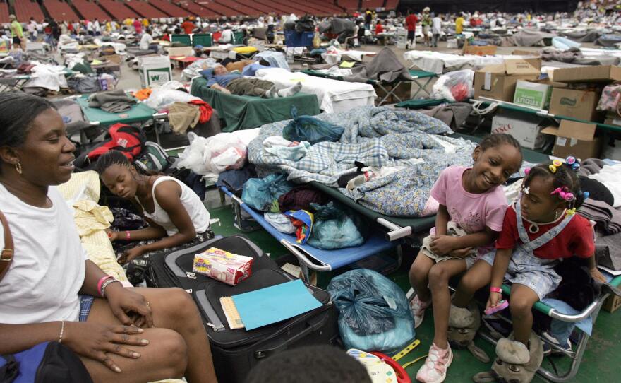 Hurricane Katrina evacuees sit on their make-shift beds on the floor of the Astrodome on Sept. 9, 2005. The stadium sheltered thousands of people fleeing from the devastation in New Orleans.