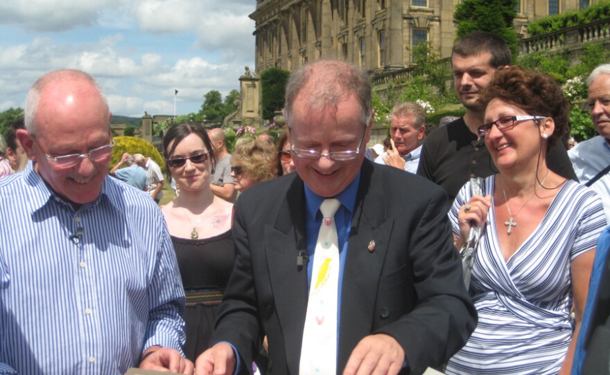 Clive Farahar values an album of Queen Alexandra’s press photos.