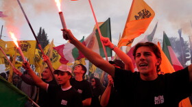 Members of right-wing student groups march through the streets of Rome, Saturday, Oct. 24, 2026, during a demonstration called "Unlock Everything," organized in opposition to recent left-wing student protests and one of several demonstrations held by groups across the political spectrum.