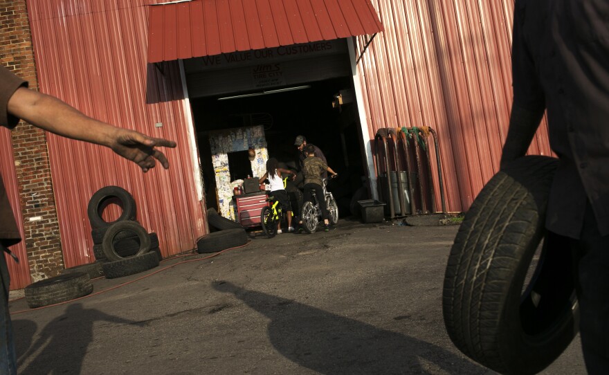 People work at Jim's Tire City on Selma Road in Springfield, Ohio. "Springfield is a rather typical small city that has grown poorer over the years," former mayor Roger Baker says.