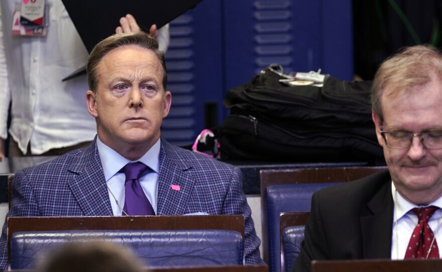 Former White House press secretary Sean Spicer and reporter for Newsmax, top left, listens during a coronavirus task force briefing at the White House in March.