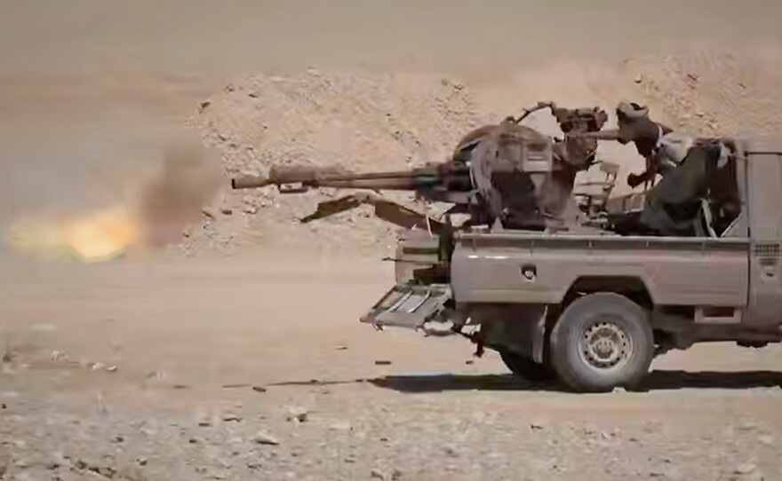 This image taken from an undated video released Tuesday, Sept. 15, 2026, by the Ansar Allah Media Office, the media arm of Yemen's Houthi rebels, shows what the group says are Houthi fighters firing a weapon mounted on a pickup truck during combat with Saudi-backed forces in eastern Jawf, Yemen.