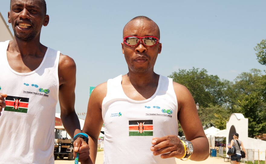 Joseph Kibunja guides blind runner Henry Wanyoike (in sunglasses).
