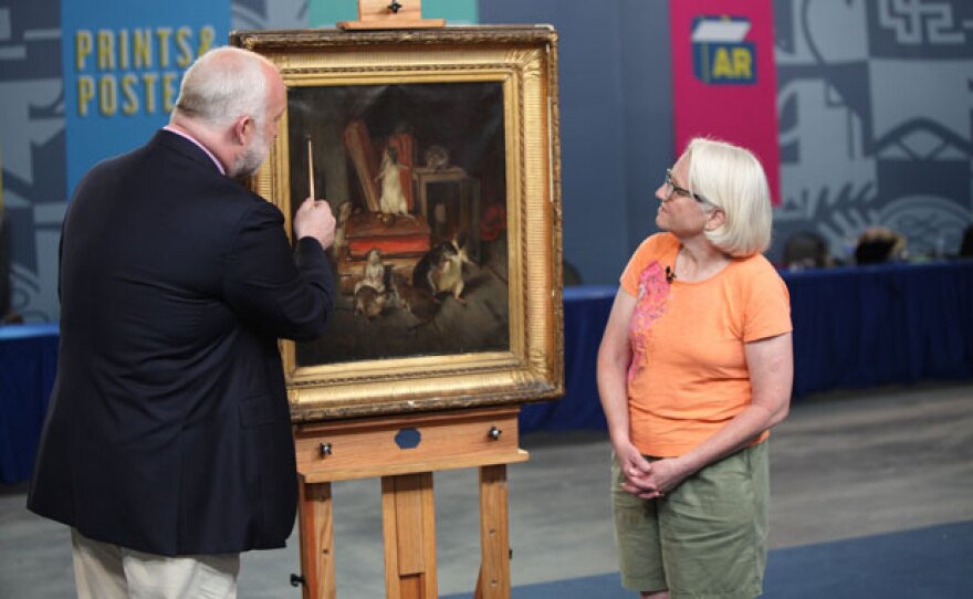 Alasdair Nichol (left) appraises a Philibert-Léon Couturier oil painting, ca. 1875 in Omaha, Neb.