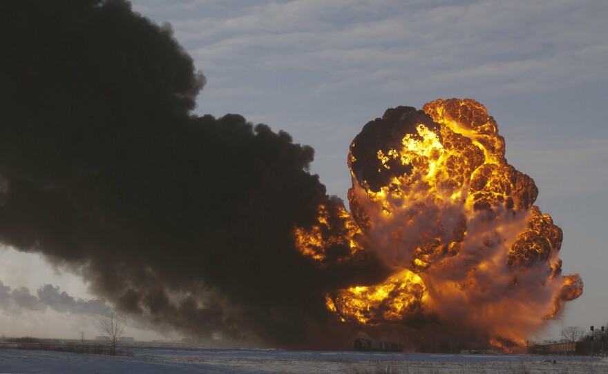 A fireball goes up at the site of an oil train derailment in Casselton, N.D., in this Dec. 30 photo. The fiery crash left an ominous cloud over the town and led some residents to evacuate.