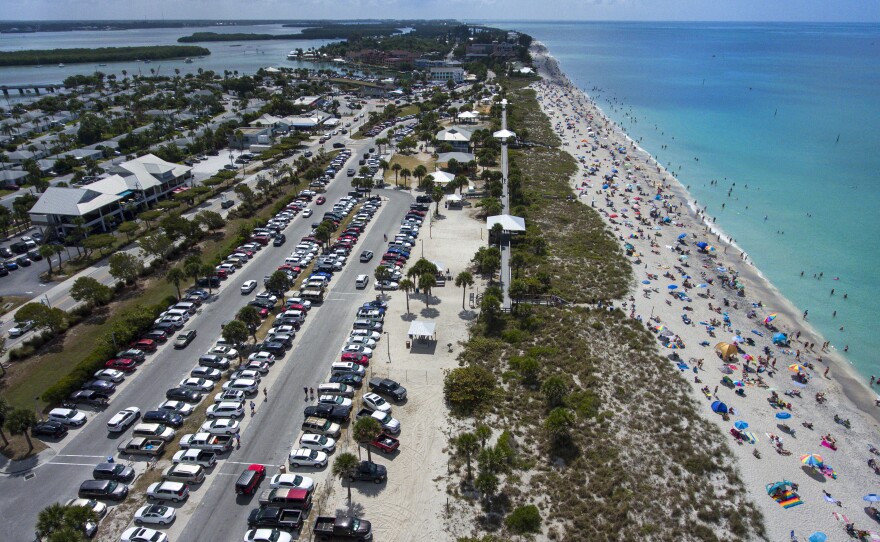 Englewood Beach in Charlotte County, Fla. was crowded on Saturday, March 20, 2020. Public gatherings like these will be prohibited beginning Thursday.