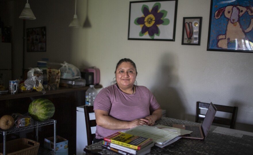 Yazmin Lopez is now the very parent she once read about in a book about personal finance: She has launched her children's credit history by adding them to her card.