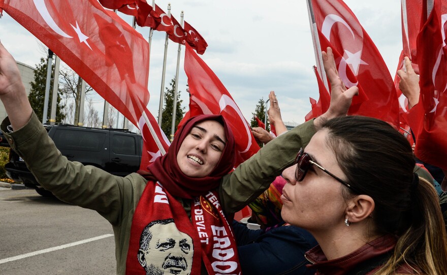 Supporters of Turkish President Recep Tayyip Erdogan wait his arrival to Turkey's capital Ankara on Monday.