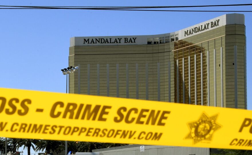 Crime scene tape surrounds the Mandalay Bay Resort and Casino in Las Vegas on Oct. 2, 2017. The broken windows show the room where a gunman sat as he opened fire on a country music festival, killing 58 people and wounding more than 500 others.
