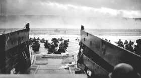 A Coast Guard-manned LCVP from the U.S.S. Samuel Chase disembarks troops of Company E, 16th Infantry, 1st Infantry Division on the morning of 6 June 1944 at Omaha Beach.