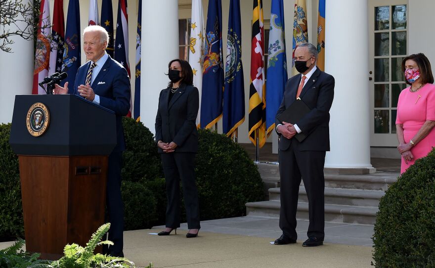 President Biden, with (L-R) Vice President Kamala Harris, Senate Majority Leader Chuck Schumer, and House Speaker Nancy Pelosi, Democrat of California, speaks about the American Rescue Plan in the Rose Garden of the White House on Friday.