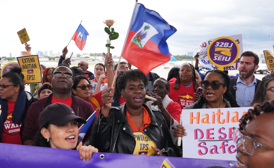 People chant during a rally in Fort Lauderdale, Fla., in support of the extension of Temporary Protected Status (TPS) for Haitian immigrants.