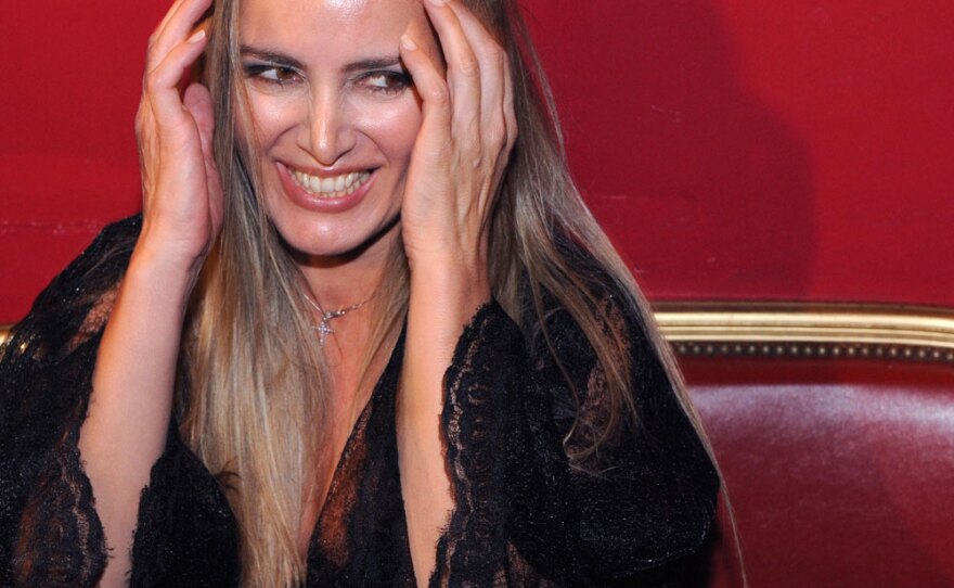 Patrizia D'Addario, a 42-year-old call girl who claims to have slept with Berlusconi, attends an "I love Silvio" theme party in a Paris nightclub on Saturday. D'Addario has been in the spotlight since announcing that she had spent the night with Berlusconi, recorded conversations with him and filmed his bedroom with her cell phone. Berlusconi says that he has never paid for sex, but admitted that he "is not a saint."