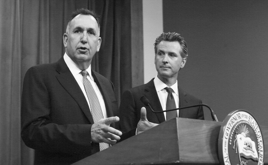 Steve Gordon, left, who was appointed by Gov. Gavin Newsom to head the California Department of Motor Vehicles, discusses a report detailing efforts by the DMV to improve customer services during a news conference in Sacramento, on July 23, 2019.