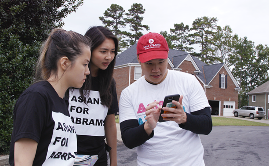 Members of Asians for Abrams, supporters of Georgia gubernatorial candidate Stacey Abrams, perform a canvass.