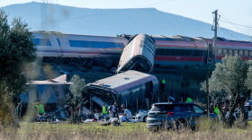 Emergency services attend to the victims at the scene of a collision between two trains in Urda, Spain, on Wednesday.