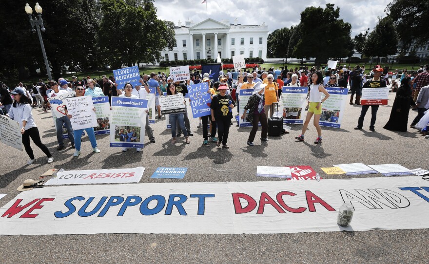 Supporters of Deferred Action for Childhood Arrivals program (DACA), demonstrate on Pennsylvania Avenue in front of the White House in Washington, D.C., on Sept. 3, 2017. A federal judge on Tuesday became the third judge to rule against the administration's plans to end DACA after federal judges in California and New York handed down similar decisions.