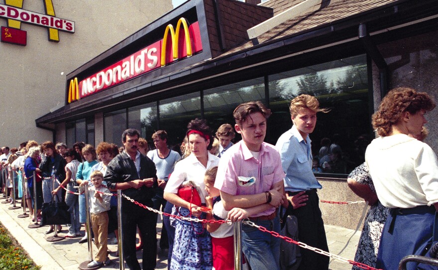 Russians wait in line outside a McDonald's fast food restaurant in Moscow in 1990.